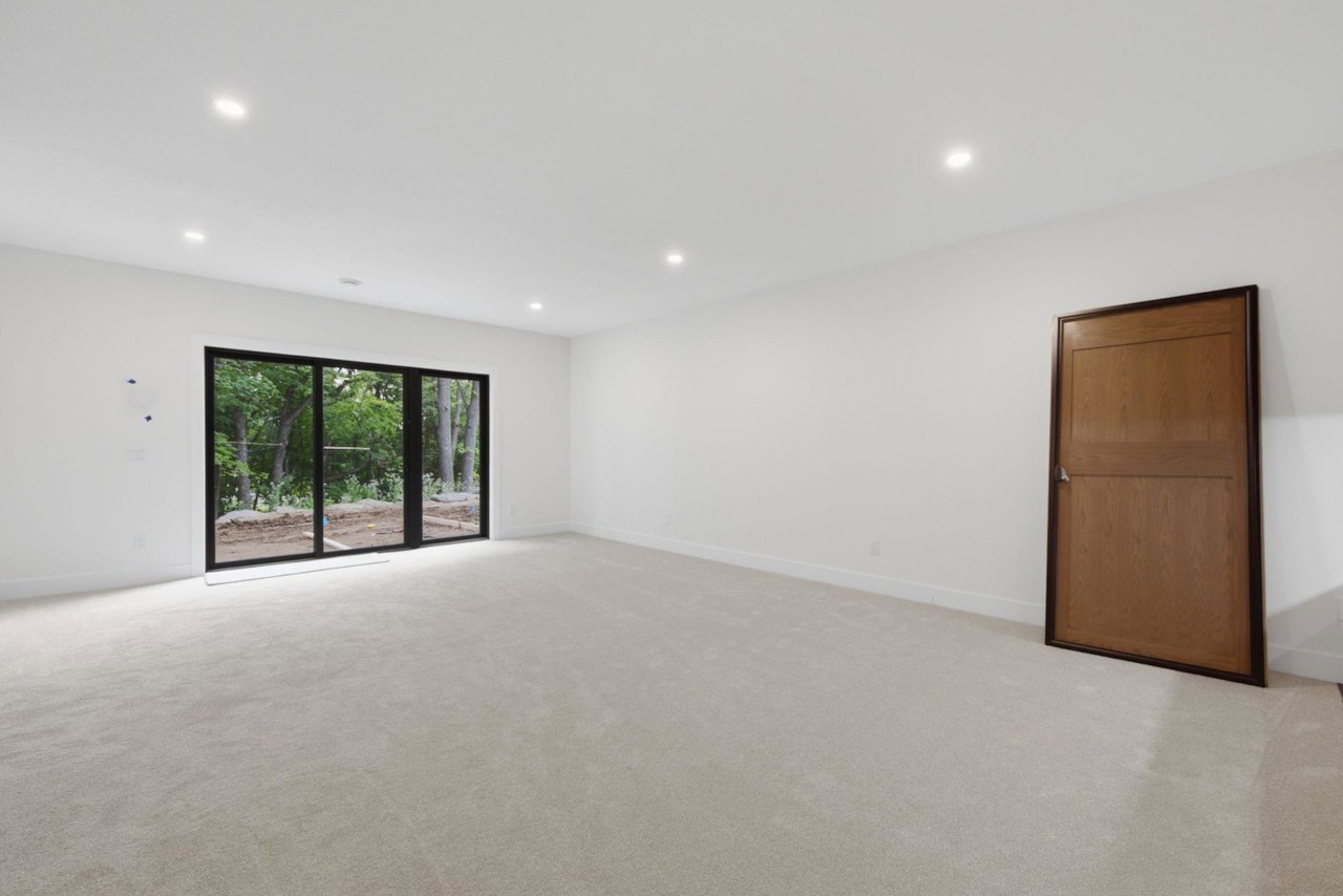 Lower-level family room with walkout doors